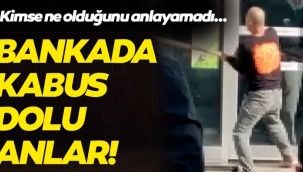 Elinde sopayla bankanın camlarını indirdi