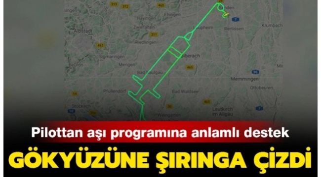 Almanya'da genç pilot gökyüzüne dev şırınga resmi çizdi