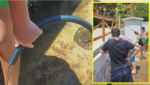 Halk plajında hortumla duş aldılar