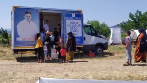 Kınık'ta gezici diş sağlığı aracında tarım işçilerine muayene