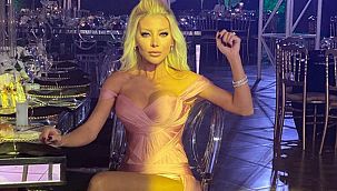 Baştan aşağı çorap giydi... Kafasını tamamen, göğüslerini taşlarla kapattı!